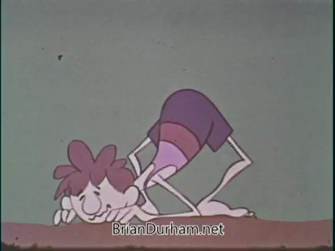 The still features a cartoon character, likely a child, in swim shorts, poised on their hands and knees, appearing to prepare for a swimming activity. The background is simple, focusing attention on the character’s playful stance. The context suggests a public service announcement promoting swimming, possibly highlighting safety or health benefits.