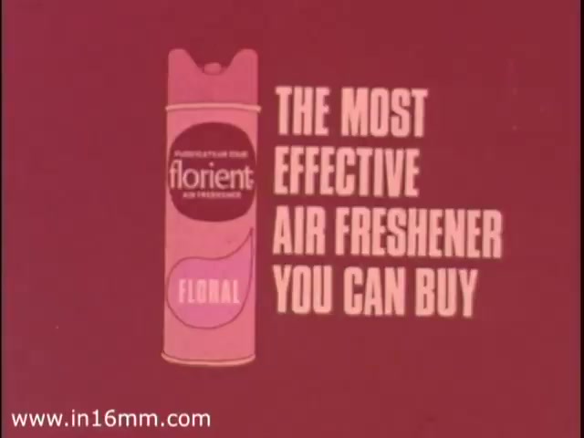 The still features a retro advertisement for Florient Air Freshener from the 1970s. The vibrant pink background prominently displays the product can, labeled 'florient' with 'FLORAL' underneath. The text reads 'THE MOST EFFECTIVE AIR FRESHENER YOU CAN BUY,' emphasizing the product's effectiveness. The overall design reflects the bold graphic style typical of that era.