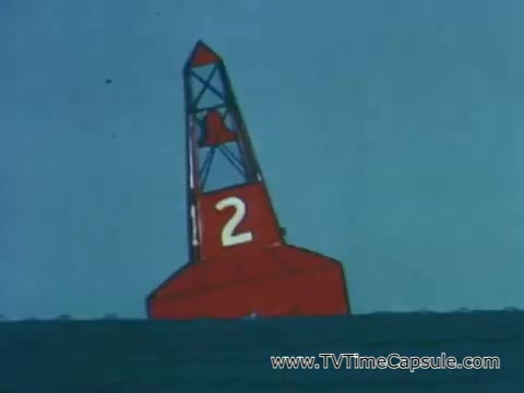 The 16mm still features a large red navigation buoy marked with the number '2,' situated in calm waters. The buoy is tall and distinctive, likely serving as a safety signal for boats. The background is a clear blue sky, emphasizing the buoy's role in guiding maritime traffic and enhancing safety on the water. This image aligns with the message of being alert to safety signals, as indicated in the context discussing the importance of safety labels on pesticide containers.