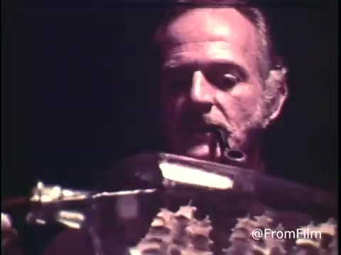 The still from the 16mm film 'C&P Telephone - 1969? Extension phones' features a close-up of a man interacting with an instrument or equipment, likely related to telecommunications. The image reflects the aesthetic of the late 1960s, showcasing the technology of that era, including the pre-1970 Bell System logo. The film captures a moment that emphasizes the practical use of extension phones in a domestic or office environment.  For more insights, follow us on Twitter @FromFilm.