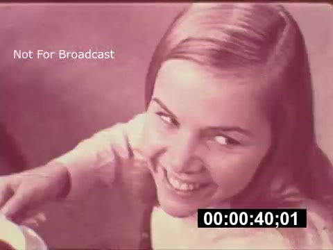 The still from the 1968 Maxwell House Coffee commercial 'The Father's Story' features a young girl with a playful smile, seemingly enjoying a moment with coffee being poured. The color tone gives it a vintage feel, characteristic of mid-20th century advertising. The scene captures a lighthearted yet nostalgic interaction, likely meant to evoke warmth and family bonding, despite its potential to come off as cringeworthy by modern standards. The timestamp suggests it's part of a commercial showcasing the product's role in family life.