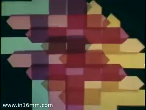 The still from the 1975 Christmas Seal PSA features an abstract composition with geometric shapes in vibrant colors like red, yellow, and green. The design is a mix of arrows and blocks, suggesting movement and direction, likely intended to convey a positive and uplifting message in line with the Christmas Seal campaign. The overall aesthetic reflects the graphic style of the era, characterizing its visual appeal.