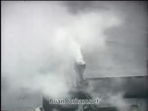 The still from the 'Clean Air PSA - 1968' depicts a scene with significant smoke or emissions, likely illustrating the pollution issue of that era. The context suggests a focus on raising awareness about air quality, emphasizing the need for cleaner air. The visual suggests industrial activity contributing to environmental concerns.