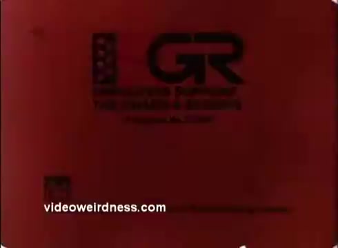 The still features a red background with a stylized graphic resembling the letters 'GR' prominently displayed. Below, there's text indicating support for the Guard and Reserve, highlighting the PSA's intention to promote employer support for military service members during the 1970s. The still also includes a website URL.