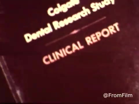 The still displays the title 'Colgate Dental Research Study' prominently, with 'CLINICAL REPORT' in bold below it. The vintage aesthetic of the 1970s is evident, reflecting the style and design typical of that era. The text emphasizes a focus on dental health and the research backing Colgate toothpaste with MFP fluoride.