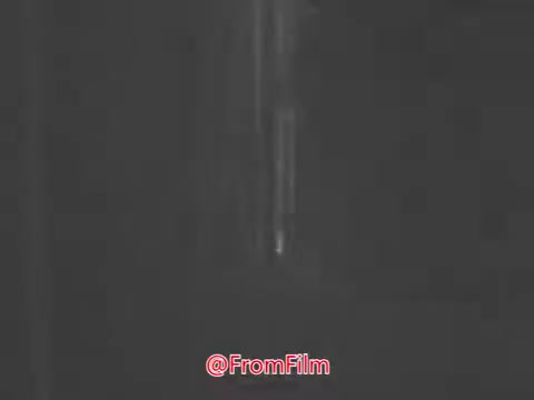 The 16mm still from 'Trick or Treat for UNICEF' (1968) features a group of children engaged in a Halloween activity, promoting the UNICEF campaign. The backdrop suggests a night scene, emphasizing the spirit of Halloween. The children, excited and spirited, chant “Trick or treat for UNICEF!” as a voiceover highlights the positive impact of their efforts on children in over a hundred countries, emphasizing health and happiness. The song 'Some Day My Prince Will Come' adds a hopeful tone to the message.