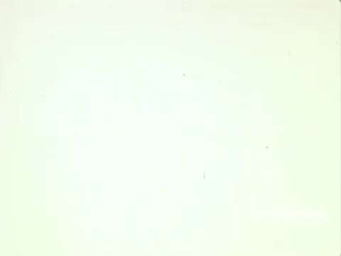 This still from 'IBM: Once Upon A Punched Card' depicts a clean, minimal background characteristic of 1960s film aesthetics. The focus is on the evolution of punch card technology, emphasizing its significance in computing history. The film likely explores the transition from early mechanical systems to more advanced computing methods, showcasing IBM's role in this transformation. The muted color palette and grain of the 16mm print evoke a sense of nostalgia, reflecting the era's vintage computing landscape. Follow us on Twitter @FromFilm for more insights!