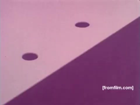 The still from 'IBM: Once Upon A Punched Card (1964)' features an abstract view of punched cards, emphasizing the iconic holes used for data input. The image plays with color, showcasing a soft gradient that highlights the card’s surface and the precision of the punched holes. This vintage frame captures the early evolution of computing technology, reflecting on the significance of punch cards in data processing during that era. A minimalist yet striking representation of the transition from manual data handling to automated systems.