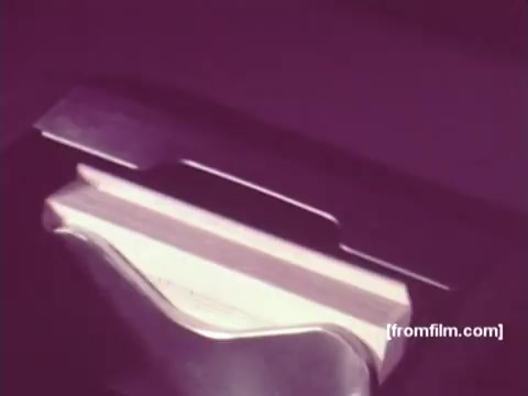 The still from 'IBM: Once Upon A Punched Card' (1964) showcases a close-up of a punched card mechanism, capturing the essence of early computing technology. The film traces the evolution of punch cards, highlighting their significance in data processing from inception to the modern era of the 1960s. The 16mm print exudes a nostalgic quality, reflecting the innovative spirit of the time. Follow us on Twitter @FromFilm for more vintage insights.