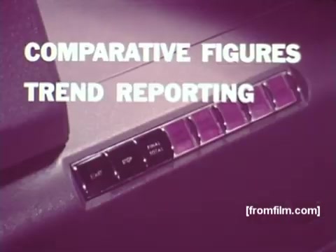 The still from 'IBM: Once Upon A Punched Card (1964)' features a close-up of a control panel with buttons for 'Comparative Figures' and 'Trend Reporting.' The scene highlights the machinery involved in data processing during the era of punched cards, illustrating the interface used for analytical tasks. The vintage aesthetic evokes a sense of innovation in computing from the mid-20th century. The print's color palette and design elements reflect the technology and design style of that period.   Follow us on Twitter @FromFilm.