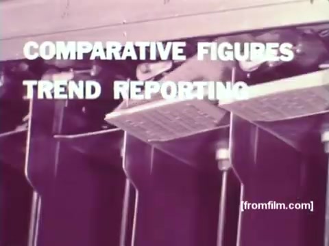 The still from 'IBM: Once Upon A Punched Card' (1964) features a close-up of a punch card processing machine. Bold text overlays the image, stating 'COMPARATIVE FIGURES' and 'TREND REPORTING,' highlighting the focus on data analysis and reporting capabilities of punch cards. The 16mm print emphasizes the vintage computing technology that IBM utilized during this era, showcasing its role in automating information processing. Follow us on Twitter @FromFilm.