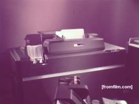 The still from *IBM: Once Upon A Punched Card (1964)* showcases a vintage computing setup featuring a punch card machine. The focus is on the intricate machinery of the era, highlighting the importance of punched cards in data processing. The muted colors suggest a historical context, capturing a moment in the evolution of computing technology. This film serves as a visual narrative of how punched cards revolutionized data handling practices from their inception to the mid-20th century.   Follow @FromFilm for more insights!