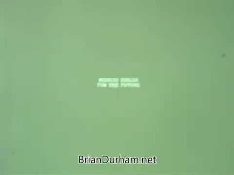 The still features a simple, green background with white text that reads 'MEDICO DREAM FOR THE FUTURE.' The design is minimalistic, typical of public service announcements from the 1960s, emphasizing a hopeful vision for healthcare and community well-being.