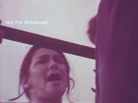 The still from the 'Molly Pitcher Bicentennial Savings Bonds PSA' features a woman expressing intense emotion, likely representing the character of Molly Pitcher. The imagery appears to evoke themes of patriotism and sacrifice, fitting the context of a public service announcement related to the bicentennial celebration and savings bonds. The scene suggests a dramatic moment, possibly highlighting the historical significance of Molly Pitcher's contributions during the American Revolution.