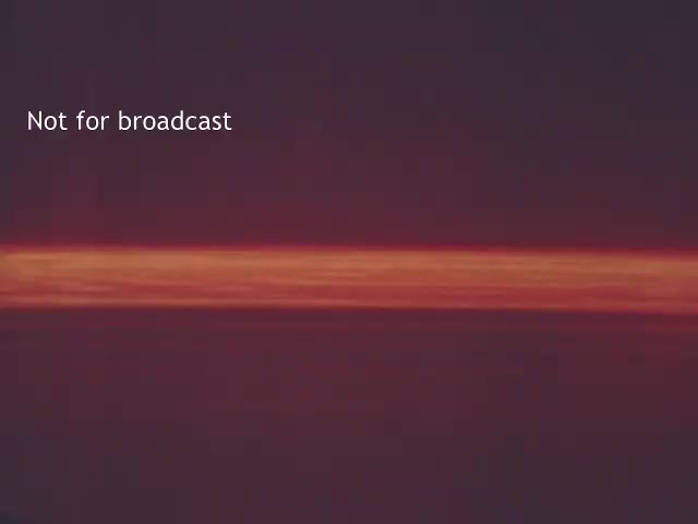 The still appears to show a gradient sky at sunset, with a horizontal band of color, transitioning from deeper tones to lighter hues. The text 'Not for broadcast' suggests it may be an archival frame. This type of imagery could have been used in a boating safety PSA from the 1970s to create a serene or dramatic backdrop while discussing safety measures. The overall aesthetic might evoke a sense of nostalgia, fitting the context of a retro public service announcement.