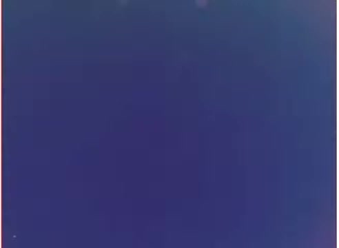 The still from the 16mm negative of the 'Purolator oil filters - 1970s' appears to be a solid, deep blue image with minimal visual detail. The colors suggest a vintage aesthetic typical of film from that era. There may be slight variations in shading, indicating a possible focus on the fluidity or cleanliness associated with oil filters. Overall, it conveys a sense of simplicity and branding context from the 1970s.