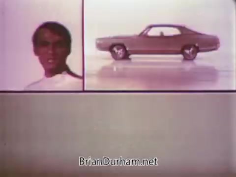 This 16mm still from the 1968 Ford Mustang commercial features Arte Johnson portraying a character from 'Laugh-In.' The frame is divided, with Johnson's expressive face on one side and a side view of the Mustang on the other, showcasing the car's sleek design. The colorful background enhances the lively, retro vibe of the ad, which promotes Ford's Pop-Option sale to viewers on WTRF in Wheeling, West Virginia.