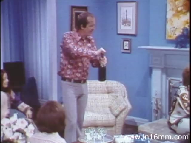 'I Am Joe's Stomach' is a 1980s educational short from Reader's Digest that utilizes a mix of three-dimensional animation and live-action sequences to illustrate the functions of the human stomach. In this still, the scene features a well-dressed man, likely hosting a gathering, as he engages with guests in a living room setting. The focus is on the importance of digestive health, conveyed through relatable characters and experiences. The narrative explores themes surrounding gastrointestinal issues, emphasizing both awareness and care related to the stomach's functions.