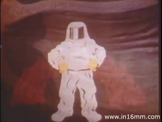 The still from 'I Am Joe's Stomach' features a figurative character dressed in a protective suit, resembling an astronaut, set against a background that likely represents the human stomach. The animation style appears to be stylized and colorful, typical of 1980s educational films. This character symbolizes the inner workings of the stomach, emphasizing its complexity and the importance of digestive health. The film combines three-dimensional animation with live-action sequences to illustrate the function and care of the stomach through engaging storytelling.