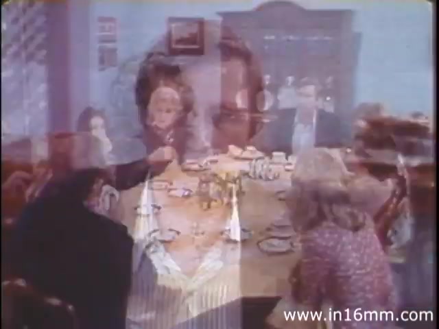 The still from 'I Am Joe's Stomach' features a family gathered around a dining table, engaged in a meal. The scene uses a mix of live-action and animation, illustrating the complexities of the human stomach's functions. Central to the narrative is the character 'Joe,' who experiences digestive issues, leading to humorous and educational insights about stomach health and the impact of diet. The setting reflects a warm, domestic atmosphere typical of the 1980s, enhancing the film's exploration of everyday life and health.