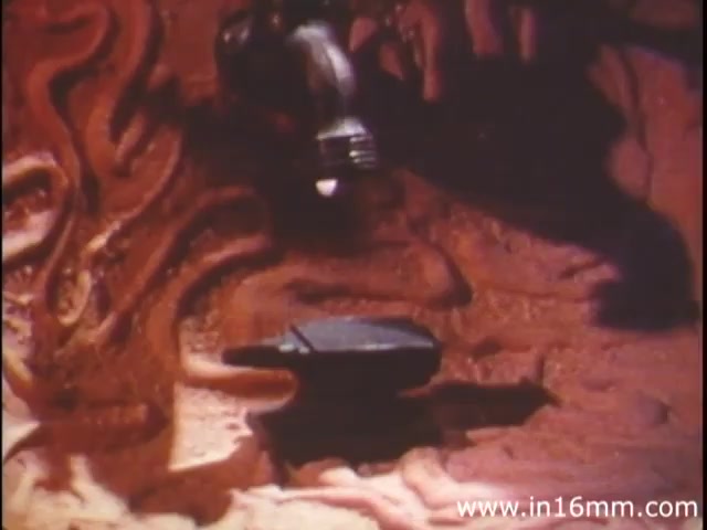 'I Am Joe's Stomach' is a short film from the 1980s produced by Reader's Digest Association, utilizing a blend of three-dimensional animation and live-action sequences to explore the functions and care of the human stomach. The film presents a narrative through the experiences of a character who faces digestive challenges. The image likely depicts a stylized representation of the stomach's inner workings, with visual elements symbolizing digestive processes, conveying the complexity and importance of gastrointestinal health. The overall tone mixes educational content with a touch of humor, aiming to engage viewers while imparting information about bodily functions.