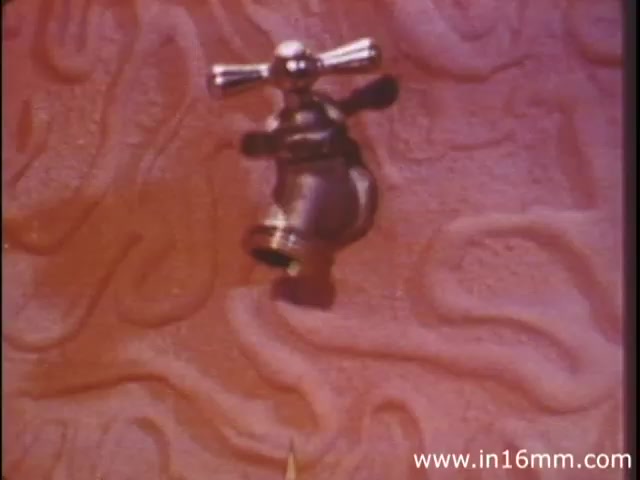 The still from 'I Am Joe's Stomach' features a stylized 3D representation of the interior of a stomach, with an animated faucet integrated into the scene. The textured background resembles the stomach lining, highlighting its complexity. This visual metaphor emphasizes the functions of digestion and the importance of gastrointestinal health, in line with the film's narrative that explores bodily processes and the consequences of neglecting them. The overall tone is educational, using imaginative elements to engage viewers in understanding human biology.