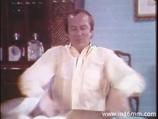 The still from 'I Am Joe's Stomach' features a man sitting at a table, expressing discomfort or frustration, likely representing the struggles associated with digestive issues. The setting seems casual, with a focus on the character's physical demeanor. This visual is part of a blend of animation and live-action that aims to educate viewers about the human stomach's functions and care, emphasizing the consequences of poor digestive health through engaging storytelling.