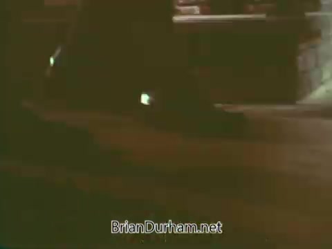 The still from the 'Boy Scouts PSA - 1960's' shows a close-up of feet walking along a path, likely during an outdoor activity. The lighting is warm, indicating a nostalgic or inviting atmosphere, typical of public service announcements from that era aimed at promoting the values of scouting. The focus on the feet suggests a theme of journey or adventure, integral to the Boy Scouts' message.