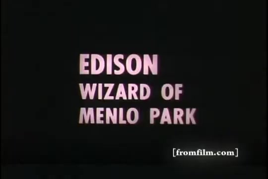 The 16mm still features bold, pink lettering on a black background, stating 'EDISON WIZARD OF MENLO PARK.' The design suggests a focus on Thomas Edison's innovative contributions, likely within a historical context related to his work and influence. The print represents a promotion or dedication, possibly connecting Edison's inventions to themes of progress or recruitment, as indicated by the film's title.
