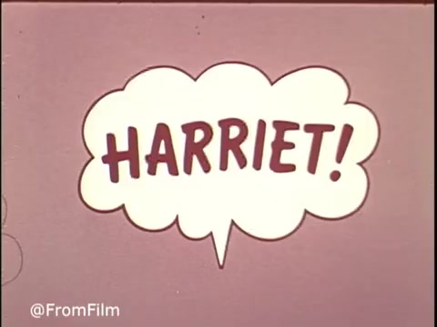 The still from the 1970s Ajax Cleanser commercial features a colorful speech bubble with the name 'HARRIET!' prominently displayed. This vibrant design aligns with the playful and engaging style typical of advertisements from that era. The commercial likely highlights the effectiveness of Ajax Cleanser, exemplified by the tagline 'Turns blue... powers out stains!' This combination serves to draw attention and convey the product's benefits in a memorable way.