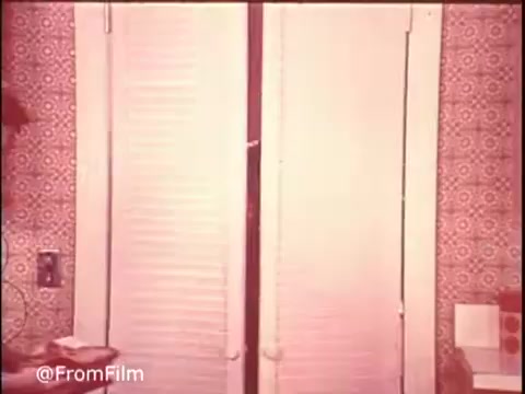 This still from the 1970s Ajax Cleanser commercial showcases a vintage kitchen scene, highlighting the product's effectiveness. The slogan 'Turns blue... powers out stains!' emphasizes the cleaning power of Ajax. The warm color palette and retro decor contribute to the nostalgic feel of the advertisement. Follow @FromFilm on Twitter for more classic commercials!