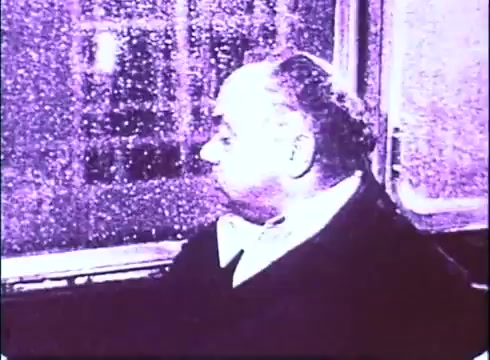 The still from the trailer of 'The Laughing Policeman' features a contemplative character, portrayed by Walter Matthau, sitting by a rain-streaked window. The muted colors and soft focus suggest a moody atmosphere, aligning with the film's themes of introspection and urban life. The reflections on the glass enhance the sense of isolation or contemplation.