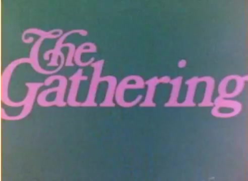 The still features the title 'The Gathering' prominently displayed in a playful, pink font against a green background. This scene is part of a silent color negative from a Kodak sales film, intended for the 1977 Christmas season, showcasing the promotional collaboration of Michael Landon and Dick Van Dyke. The visual style highlights the nostalgic aesthetic typical of the era.