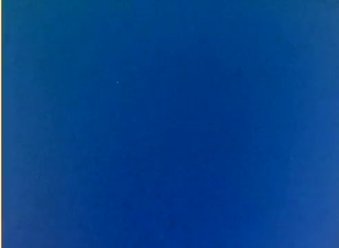 The still from the 'Kodak 1977 Sales Film' appears to be a blank blue frame from a silent color negative. This suggests that the moment captured may not contain any imagery related to Michael Landon or Dick Van Dyke, possibly serving as an introductory or transitional scene in the film. The simplicity of the blue background highlights the focus on the film's visual quality rather than content.