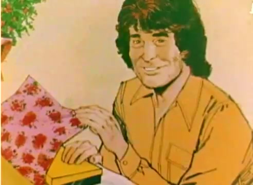 The still from the 'Kodak 1977 Sales Film' features a stylized illustration of Michael Landon. He is smiling and interacting with colorful holiday-themed wrapping paper and a yellow box, evoking a festive atmosphere. The scene captures a cheerful, nostalgic moment, aligning with the promotional theme of the Christmas season. The overall presentation reflects the tone of a sales film aimed at highlighting Kodak products during the holidays.