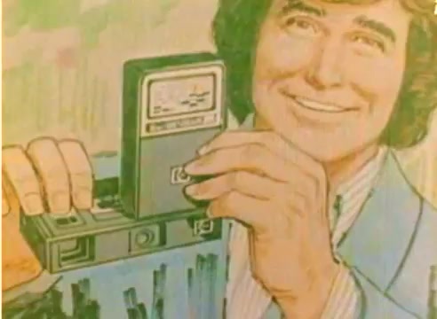 The still features a smiling man, likely Michael Landon, using a vintage Kodak camera, showcasing the technology of the era. The image is vibrant with a retro aesthetic, emphasizing the excitement of the 1977 Christmas season. The background suggests a cheerful, promotional context, typical of sales films aimed at highlighting Kodak products.