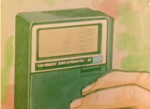 The still from the 'Kodak 1977 Sales Film' features a close-up of a hand operating a vintage portable device, possibly a tape recorder or player. The device has a green casing with a visible screen displaying text or information. The background is softly colored, enhancing the nostalgic feel of the scene. The overall aesthetic reflects the 1970s style, aligning with the promotional theme for the Christmas season.