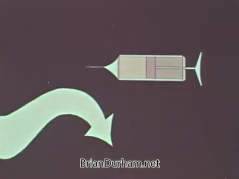 The still features a simple graphic representation of a syringe, accompanied by a flowing, curved line that suggests the administration of a vaccine or medication. The background is likely a solid color, emphasizing the syringe as the focal point. This visual is consistent with public service announcements from the 1960s that aimed to educate the public about health and medical practices.