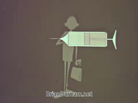 The still features a simple, cartoonish character holding a large syringe with a neutral expression. The background is likely a plain color, emphasizing the character and the syringe, which symbolizes vaccination or medical awareness. The overall style is typical of educational public service announcements from the 1960s, aiming to convey a health-related message in a straightforward manner.