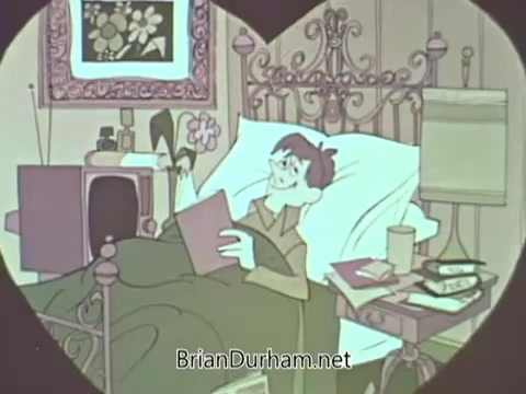 The still is an animated depiction from a 1960s American Medical Association PSA. It features a young man comfortably resting in bed, with a book in hand and a relaxed expression. The room is cozy, with items like a flower vase and a television visible. The overall tone appears light and informative, likely promoting health and well-being messages typical of the era.