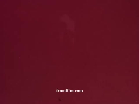 The still from 'Avon Llama (Avon Calling)' appears to be a close-up shot with a predominantly red background. It features a slight blur or fade, possibly indicating an artistic or experimental choice typical of 1970s film. The overall image lacks distinct details, creating a focused yet abstract visual.