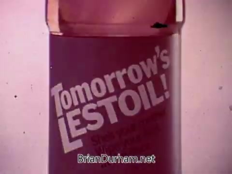 The still features a bottle of Lestoil cleaner prominently displayed with bold text reading 'Tomorrow's LESTOIL!' The background is likely simple to keep the focus on the product. The overall tone suggests a lively, upbeat atmosphere typical of a musical advertisement, aiming to highlight the product's effectiveness and appeal. The image evokes a sense of freshness and optimism associated with cleaning and home care.