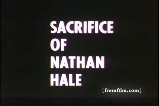 The still features a black background with bold white text reading 'SACRIFICE OF NATHAN HALE.' It is likely part of a documentary or educational film segment highlighting significant moments in history, specifically focusing on the life and legacy of Nathan Hale, an American soldier and spy during the Revolutionary War. The use of a simple, stark design emphasizes the seriousness of the subject matter. The lower right corner includes a credit reference to 'fromfilm.com.'