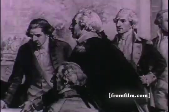 The still depicts a historical scene with men in 18th-century attire, likely representing key figures in a significant event related to army recruiting. The individuals appear engaged in discussion or deliberation, suggesting a moment of decision-making or planning. The visual style reflects the era, with an emphasis on authority and the gravity of historical context.