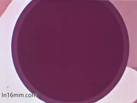 The 16mm still from the 'Blue Shield Hunting Safety PSA' from the 1960s likely features a simple, graphic design typical of the period. The image could represent safety themes, possibly using bold colors and circular shapes to draw attention. The overall aesthetic may emphasize clarity and direct messaging, in line with public service announcements of that era focused on promoting safe hunting practices.