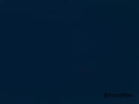 The still from the 1970s Golden Griddle Pancake Syrup advertisement features a classic design typical of the era, emphasizing cheerful breakfast moments. The color palette is likely warm and inviting, showcasing syrup being poured over fluffy pancakes, creating an appealing visual for viewers. The branding might include the iconic logo, emphasizing nostalgia and family-oriented themes. Overall, it captures the essence of a delightful breakfast scene that the product aims to promote.