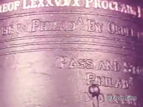 The still from the 16mm print of the 'Jewish Chautauqua Society PSA 1975' features a close-up of the Liberty Bell. The bell's surface is prominently displayed, showcasing its inscriptions and aged texture. The visual ties into the voiceover's message about the significance of liberty and the ongoing struggle against oppression, emphasizing that true freedom cannot exist while others suffer.