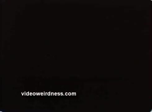 The still appears to be a black frame, possibly indicating a pause or transition in the animated short 'Animated Navy PSA - Navy Nurses.' The only visible text is the website 'videoweirdness.com' at the bottom, suggesting it might be a source or reference related to the PSA. No details about the content or imagery can be discerned from this still.