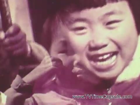 The still from the 'Christian Children's Fund PSA' features a joyful young child with short hair, smiling broadly. The image appears slightly blurred and overlaid, possibly indicating movement or a collage effect. The background suggests an outdoor setting, enhancing the cheerful atmosphere. The overall tone of the image conveys happiness and a sense of innocence, typical of public service announcements aimed at highlighting children's needs and encouraging support.