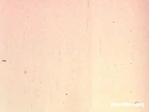 The still from the 16mm print of the 'Pepperidge Farms - Apollo 17' commercial features aged film grain and a warm, faded color palette typical of vintage footage. The image shows a blurred or soft background, likely indicating a transition or title sequence related to the theme of space exploration and the connection to Apollo missions. The overall aesthetic evokes nostalgia, emphasizing the historic nature of the product featured in the context of space history.